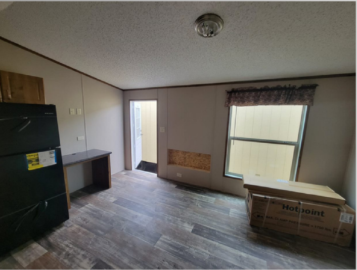 Spacious bedroom with large window